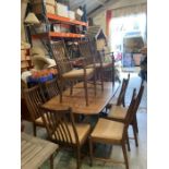 An Ercol gold label table along with eight chairs and two carvers (74cm x 159cm x 100cm)