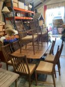 An Ercol gold label table along with eight chairs and two carvers (74cm x 159cm x 100cm)