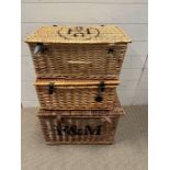 Three wicker hampers, one stamped Fortnum and Mason and one stamped Holland Park