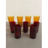 Nine coloured glasses or candle holders