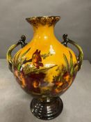 A two handled Madras ware vase decorated with floral theme 81cm H