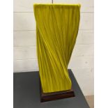 A twisted fabric table lamp