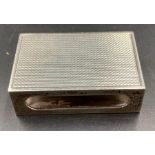 A silver matchbox holder, hallmarked for London 1965. 44mm long