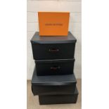 Four Black dressing room storage boxes and designer box