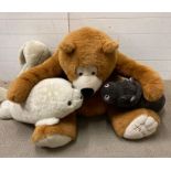 A selection of cuddly toys to include large Harrods Bear and a Russ seal.