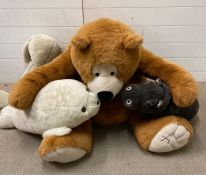 A selection of cuddly toys to include large Harrods Bear and a Russ seal.