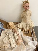 A Vintage doll with original clothes, china face and stamped Paris S F B J BEBES