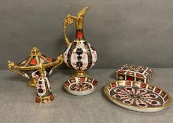 A selection if Royal Crown Derby to include pin dishes, a candle snuffer and a swan neck ewer.