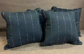 Four blue outdoor cushions