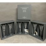 Three sets of Waterford crystal champagne glasses in original presentation boxes