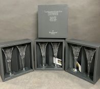 Three sets of Waterford crystal champagne glasses in original presentation boxes