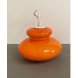 A Mid Century orange ceiling light glass shade