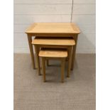 A nest of three pine side tables (H50cm W57cm D34cm)