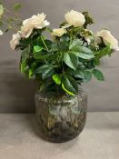 A Danish glass wave vase with faux floral arrangement