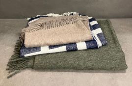 A Johnathan Adler and two OKA Alpaca and wool throws