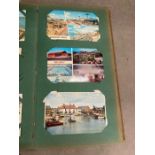 A selection of vintage photograph and postcard albums