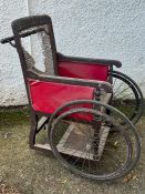 A Carters of London Victorian wheel chair with brass detail handles, cane seating AF
