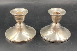 A pair of weighted sterling silver squat candlesticks 8cm H