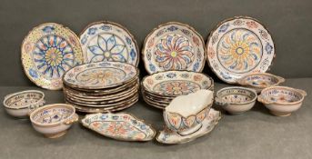 A selection of French Quimper ware to include plates and bowls, various patterns AF