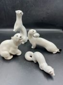 Four white porcelain animals
