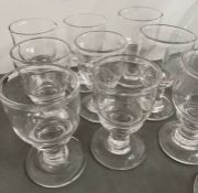 A large selection of Simon Pearce glassware, hand blowen including pitchers, jugs, pilsner, Essex