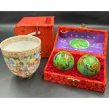 A boxed cup and healing balls