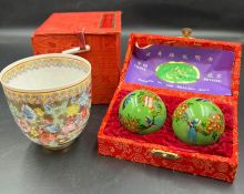 A boxed cup and healing balls