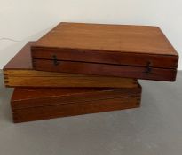 Three specimen boxes, one with specimens