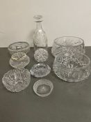 A selection of cut glass and engraved crystal glasses, along with bowls