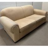 Two seater sofa with cream upholstery and block wood feet (H90cm W200cm D95cm SH45cm)