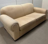 Two seater sofa with cream upholstery and block wood feet (H90cm W200cm D95cm SH45cm)