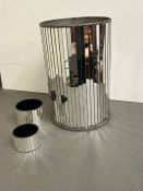 A mirrored bin and two small mirrored pots