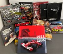 A selection of Formula 1 racing reference books, mostly in Spanish.
