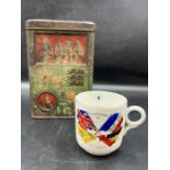 A vintage commemorative military biscuit tin possibly Boer War and a Champions of Liberty Cup