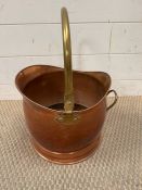 A copper and brass coal bucket