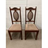 A pair of Arts and Craft style chairs