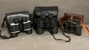 Three pairs of binoculars to include Tasco, Praktica and a pair of vintage field binoculars