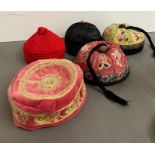 A selection of Nepalese and mandarin embroidered smoking caps.