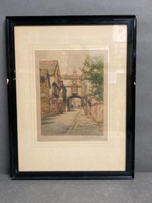 A tinted etching of a street scene signed bottom right Henry G Walker in pencil