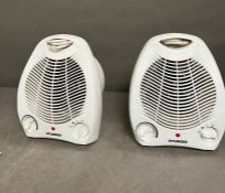 A pair of electric heater fans