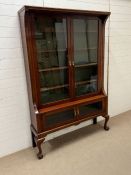 A double glazed cabinet with glazed cupboard to base on ball claw front feet (H193cm W127cm D31cm)