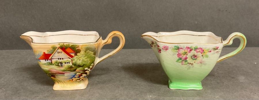 Two Royal Winton milk jug