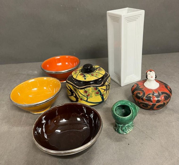 Art Deco style lidded pot along with metal rimmed dishes and vases