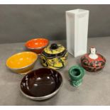 Art Deco style lidded pot along with metal rimmed dishes and vases