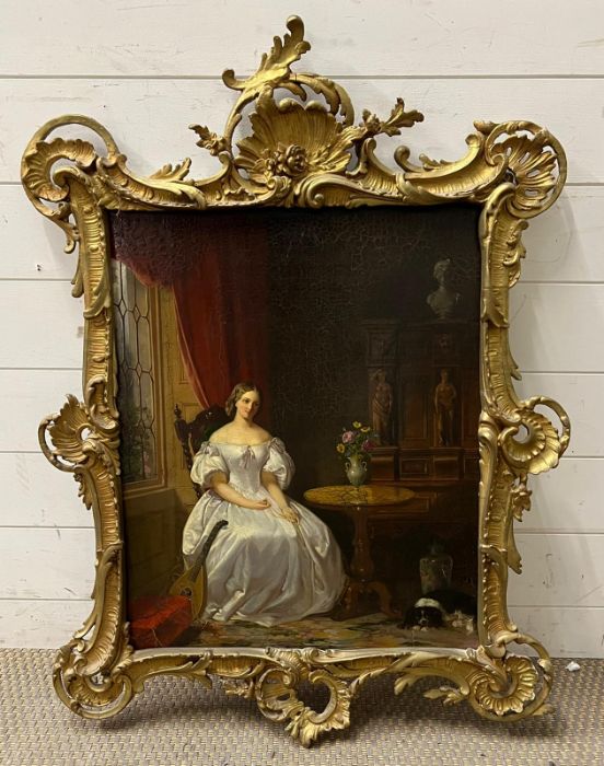 A portrait of a lady in her parlour in a gilt frame, unknown artist