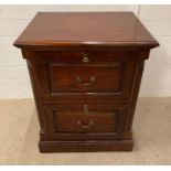 A mahogany two drawer filing cabinet