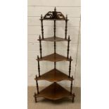 A five tier mahogany corner shelving unit (H136cm)