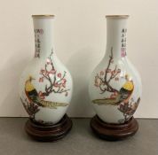 Two Chinese porcelain vases on plinths