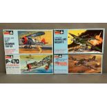 A selection of four boxed monogram model plane kits, Grumman Fighter, Thphoon, DeHavilland