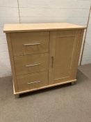 A three drawer, one cupboard chest (H90cm W96cm D52cm)